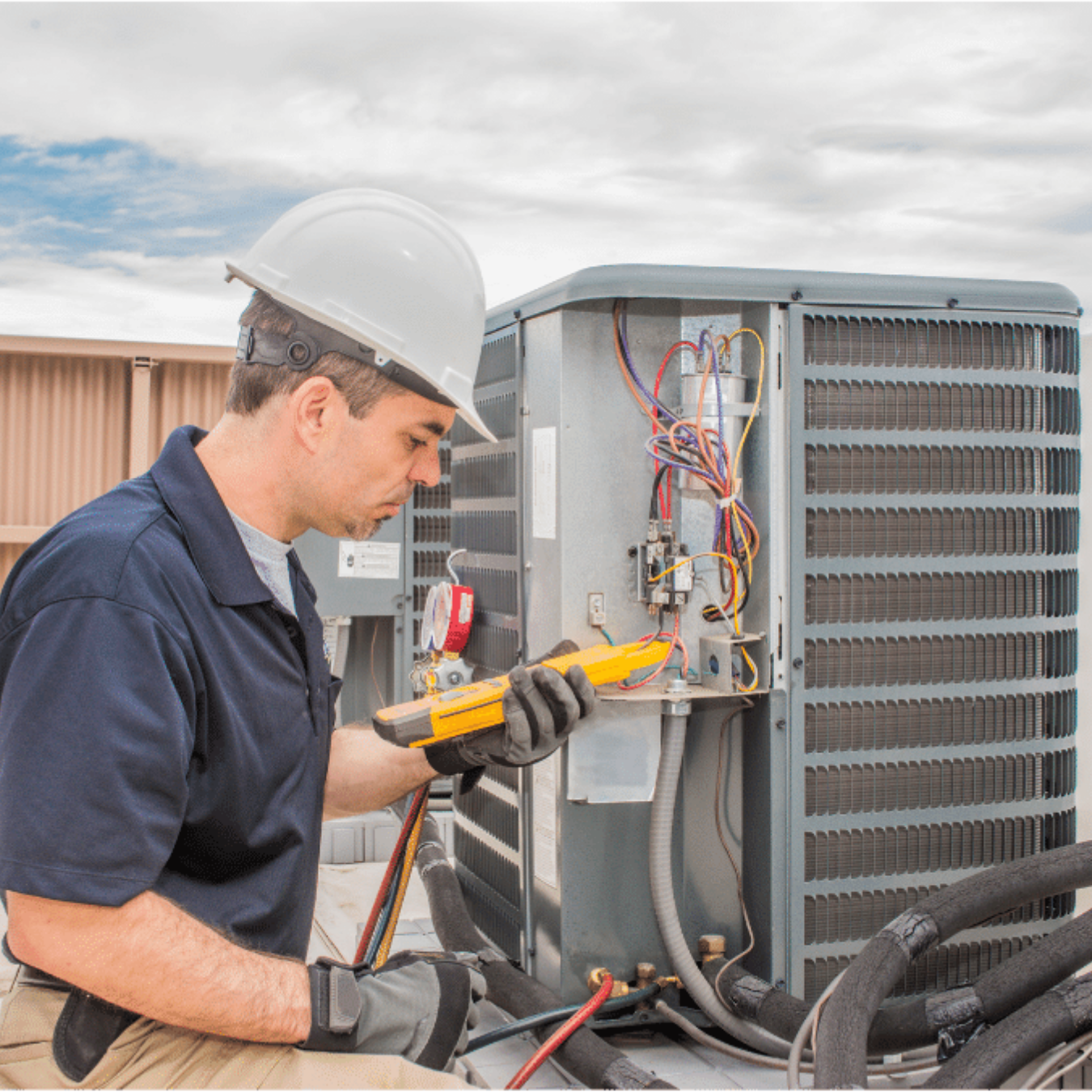 Keswick Heating & Cooling HVAC technician servicing a system