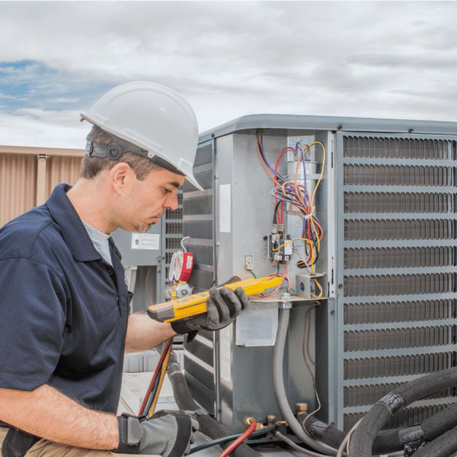 Keswick Heating & Cooling HVAC technician servicing a system